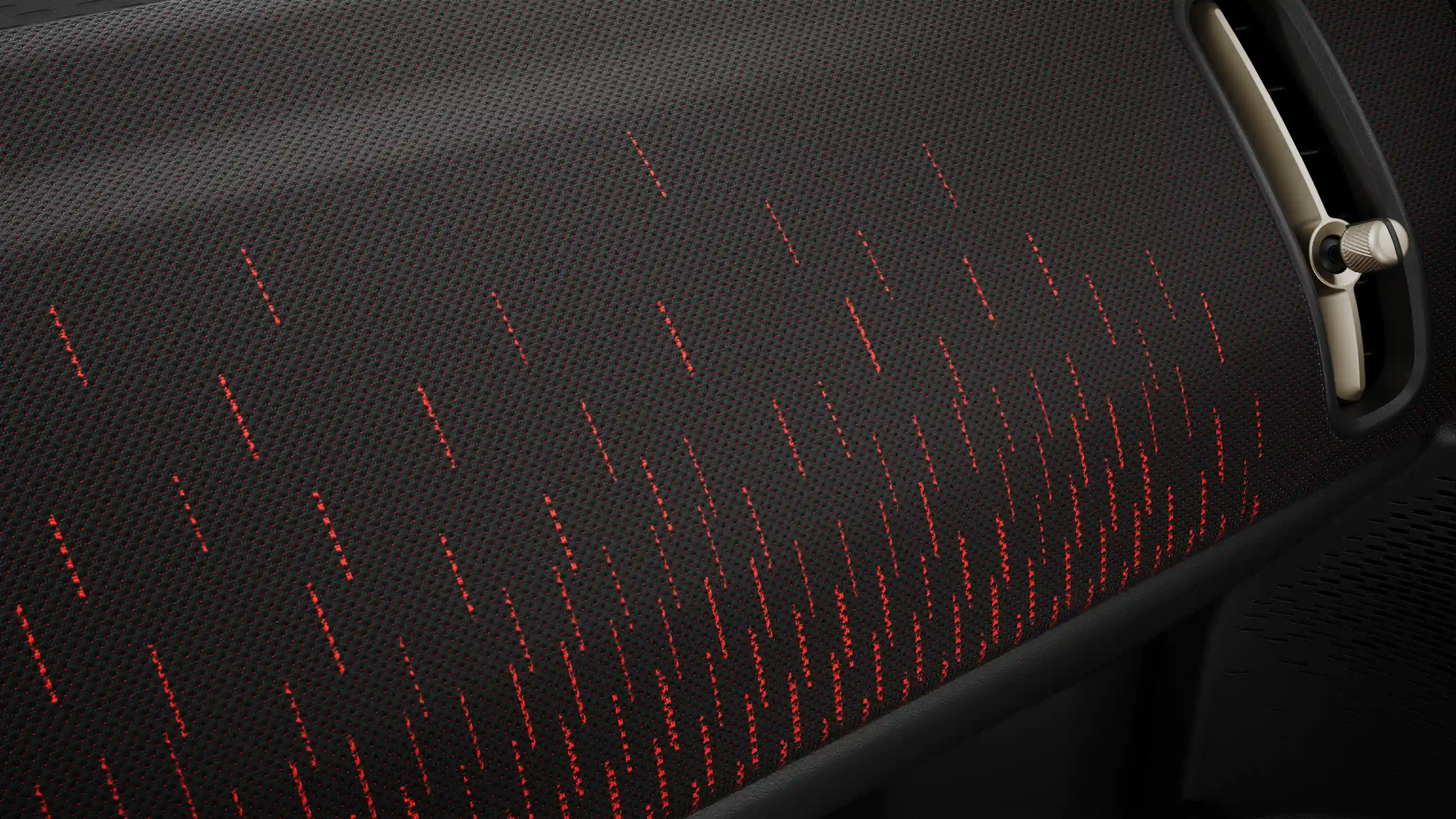 Prikaz crvene-crne kontrolne table u JCW stilu potpuno električnog MINI Countryman-a